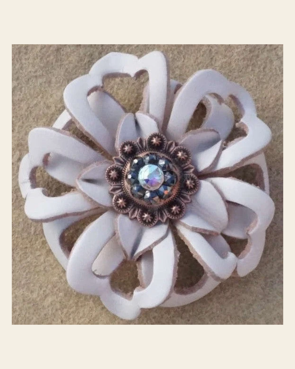 White Lotus Flower With Copper Jet and AB 1" Concho on a warm cream background