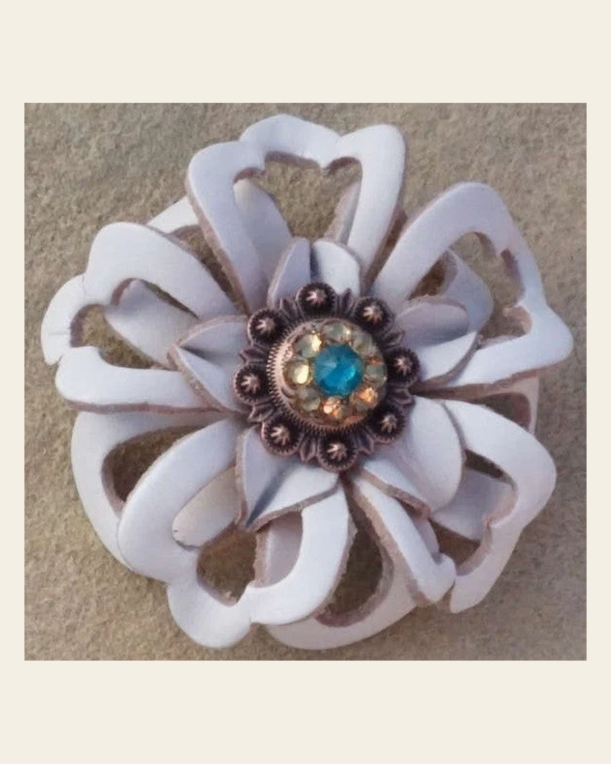 White Lotus Flower With Copper Teal and Champagne 1" Concho on a warm cream background