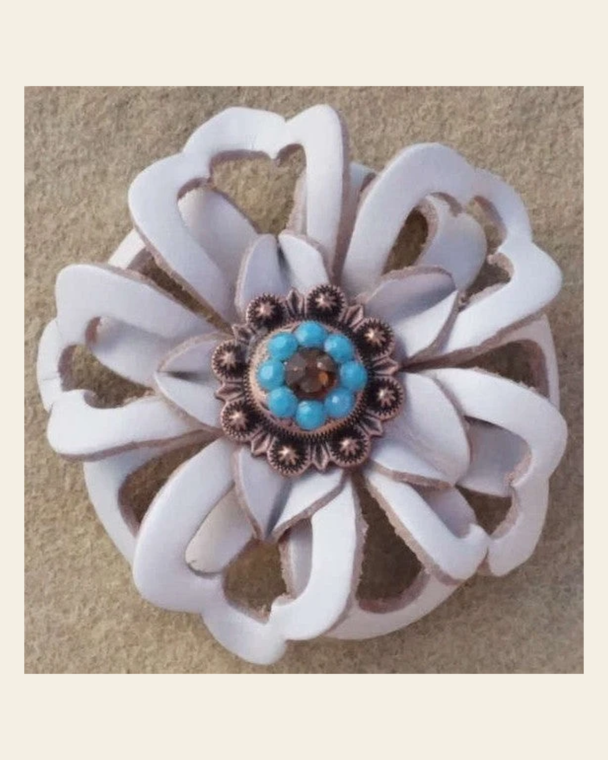 White Lotus Flower With Copper Topaz and Turquoise 1" Concho on a warm cream background