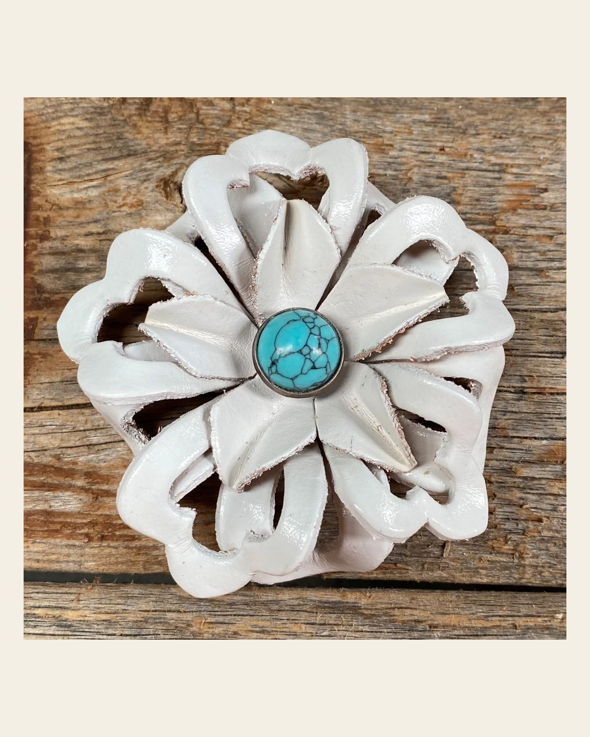 White Lotus Flower With Round Turquoise Cabochon on a warm cream background