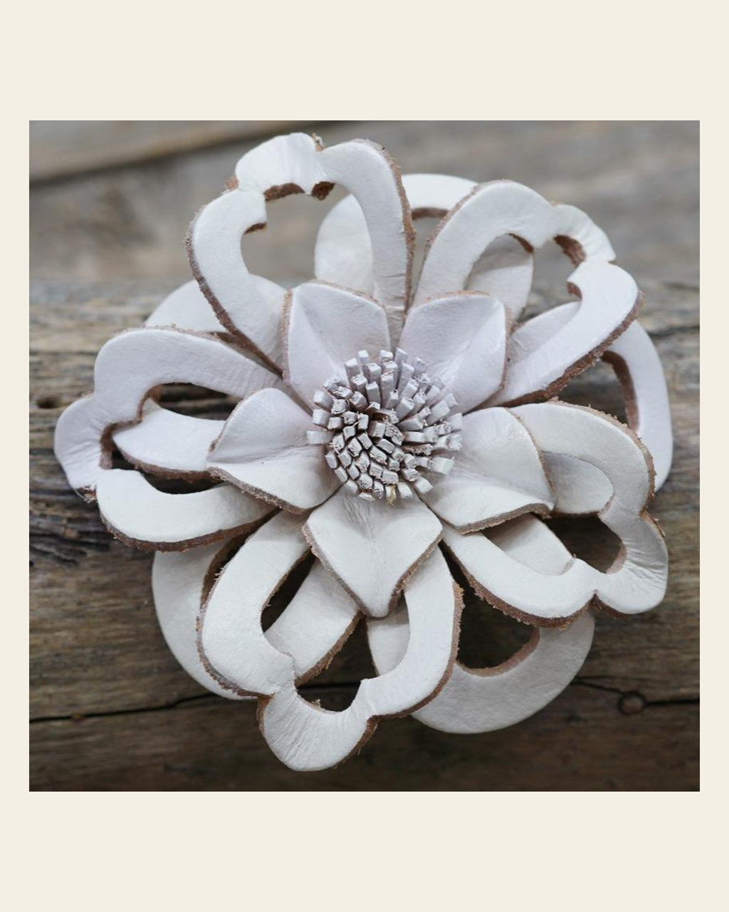 White Lotus Leather Flower on a warm cream background