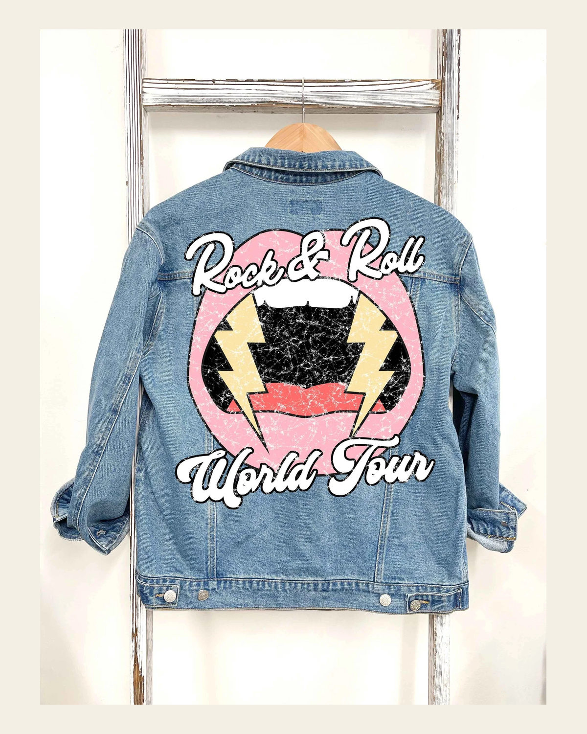 World Tour Graphic Denim Jacket on a warm cream background