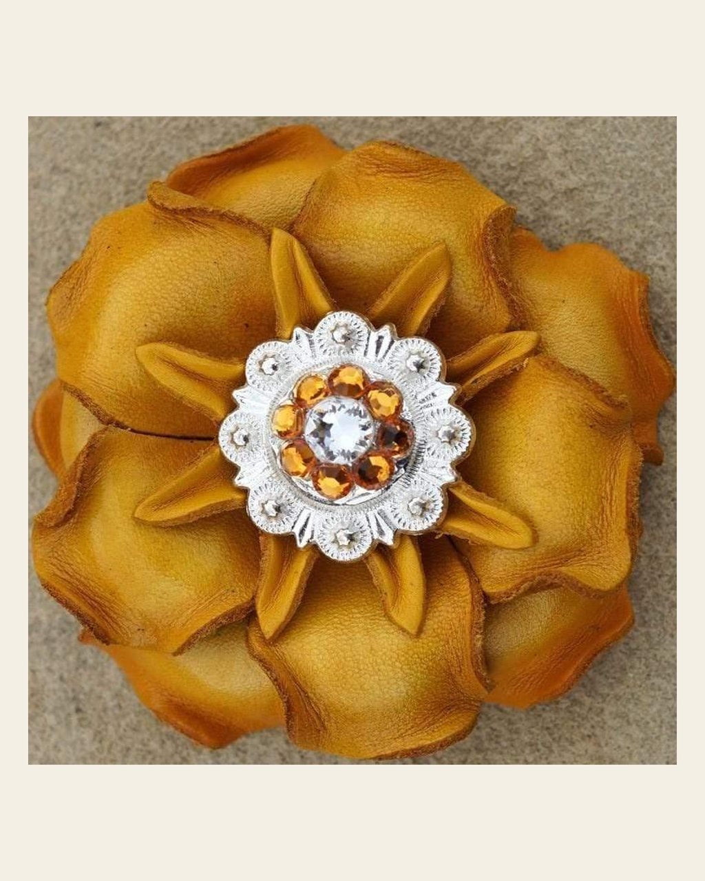Yellow Gardenia Flower With Bright Silver Golden & Clear 1" Concho on a warm cream background