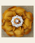 Yellow Gardenia Flower With Bright Silver Golden & Clear 1" Concho on a warm cream background