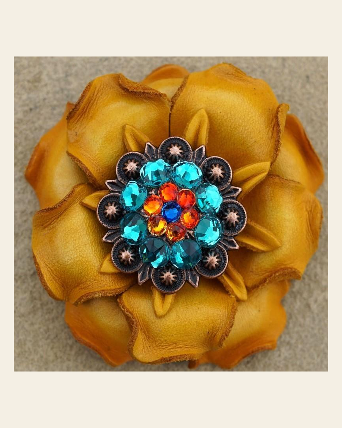 Yellow Gardenia Flower With Copper Capri, Fire Opal & Teal 1.25" Concho on a warm cream background