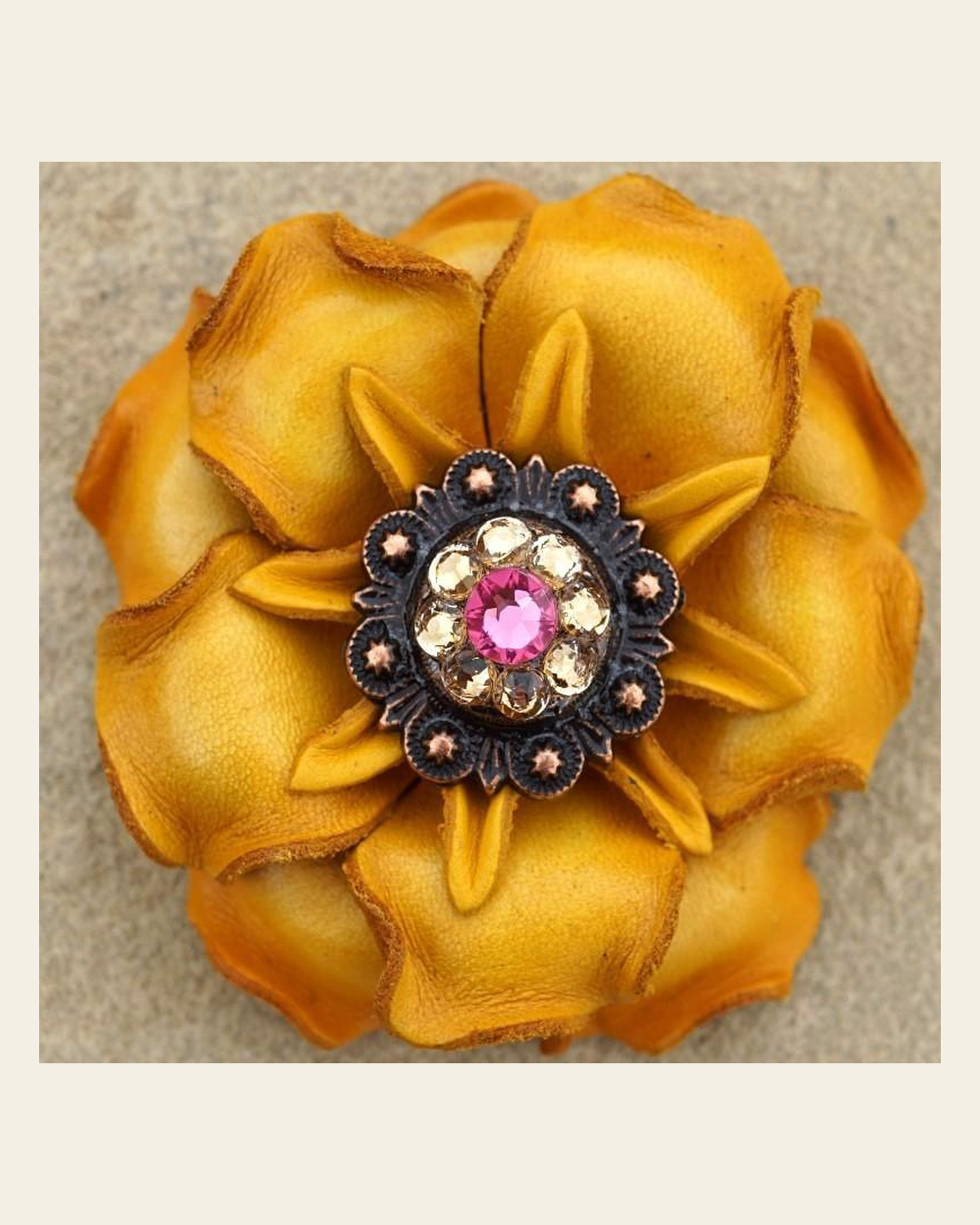 Yellow Gardenia Flower With Copper Pink & Champagne 1" Concho on a warm cream background