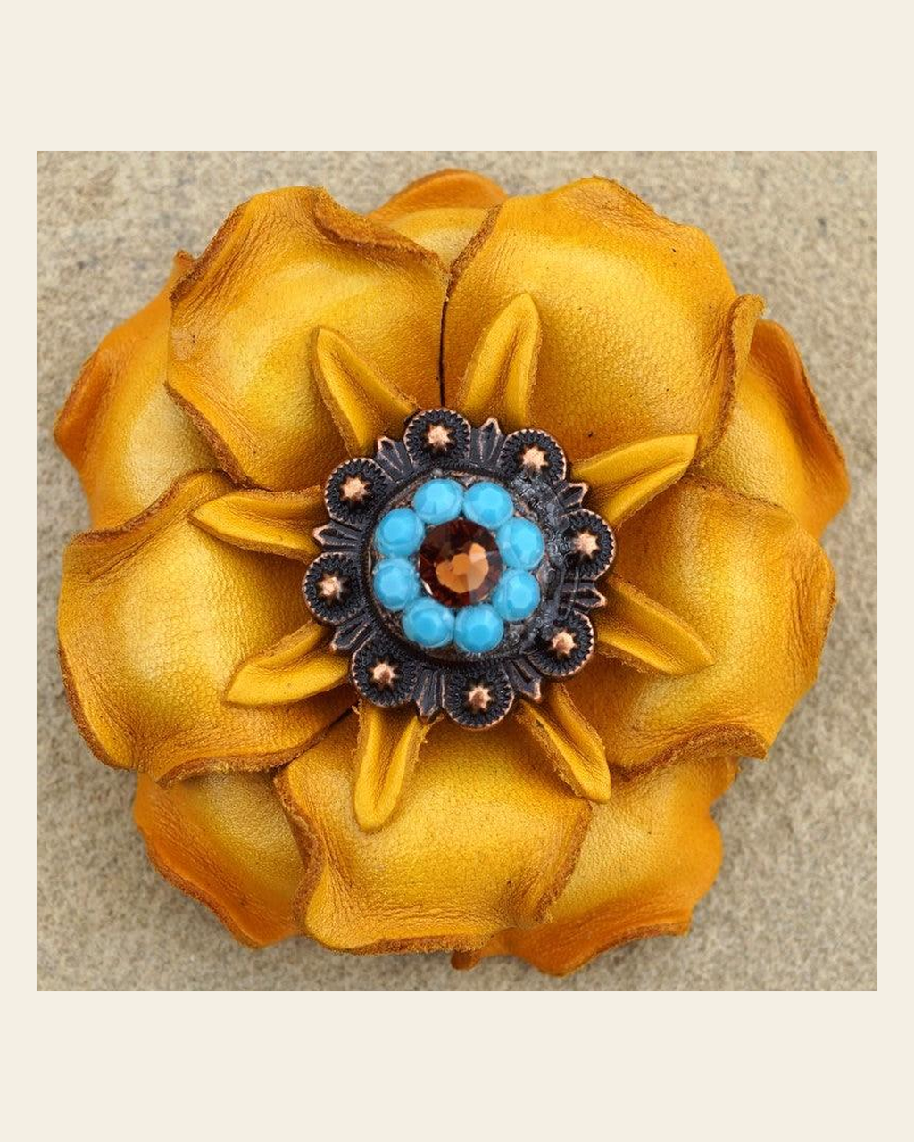 Yellow Gardenia Flower With Copper Topaz & Turquoise 1" Concho on a warm cream background