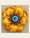 Yellow Gardenia Flower With Copper Topaz & Turquoise 1" Concho on a warm cream background