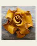 Yellow Rose Leather Flower on a warm cream background