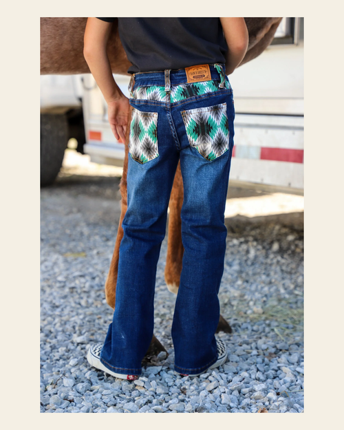 *youth* Brayden Denim Boot Cut Jeans (numerical) on a warm cream background