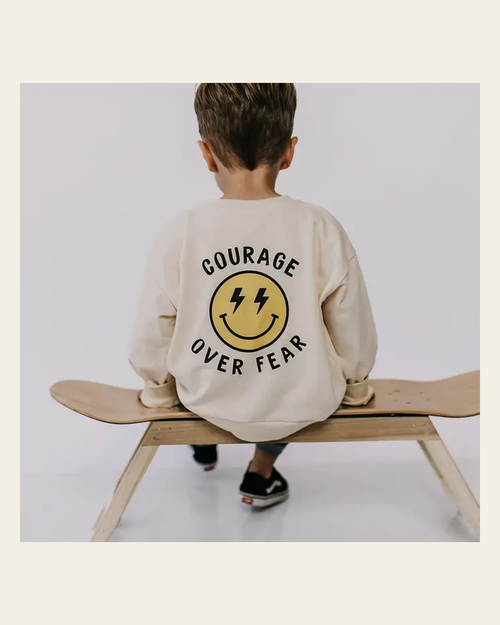 *youth* Courage Over Fear | Crewneck on a warm cream background