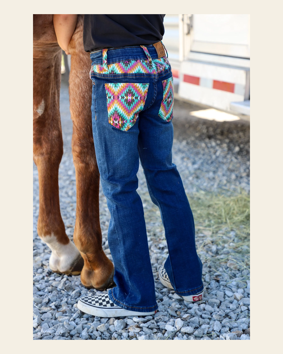 *youth* Dakota Bootcut Denim Jeans on a warm cream background