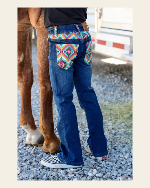 *youth* Dakota Bootcut Denim Jeans on a warm cream background