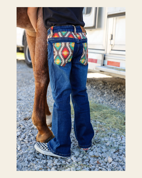 *youth* Hayes Bootcut Denim Jeans on a warm cream background