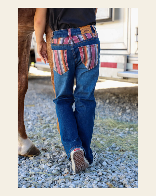 *youth* Purple Serape Bootcut Denim Jeans on a warm cream background