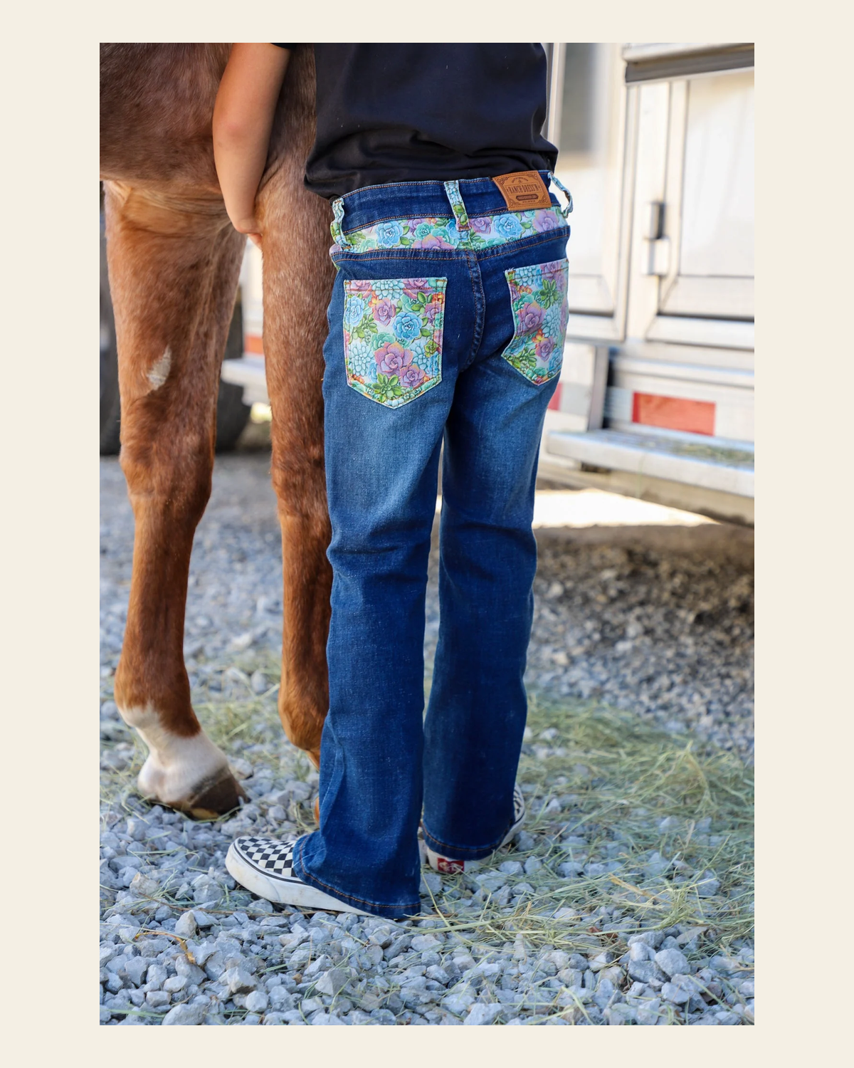 *youth* Succulent Bootcut Denim Jeans on a warm cream background
