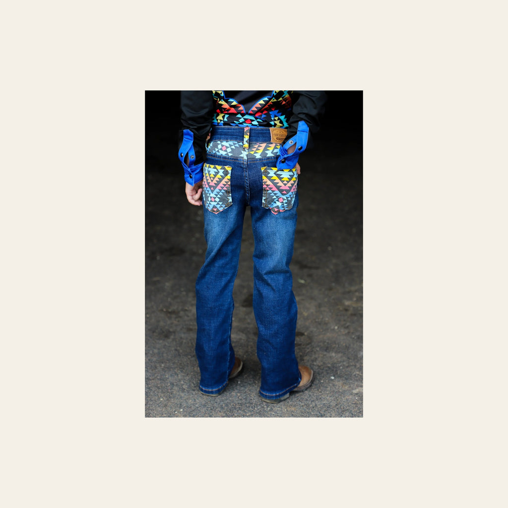 *youth* Arizona Bootcut Denim Jeans on a warm cream background